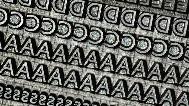 A close up photo of a number of rows of letters