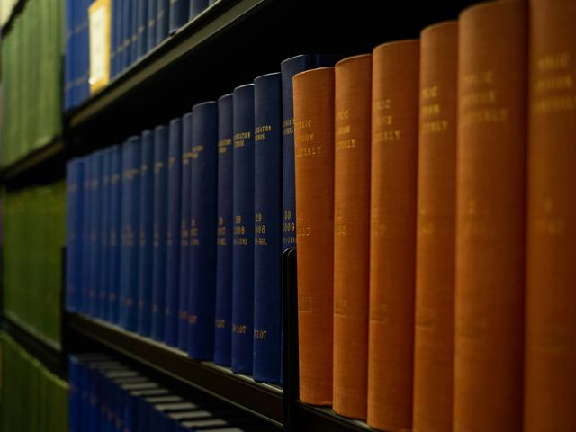 A photo of a row of books in a library